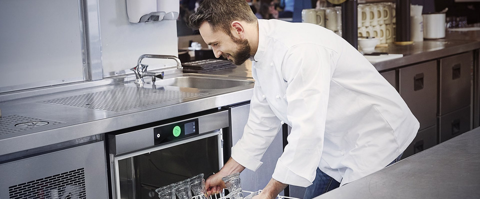 Chef loading HOBART dishwasher